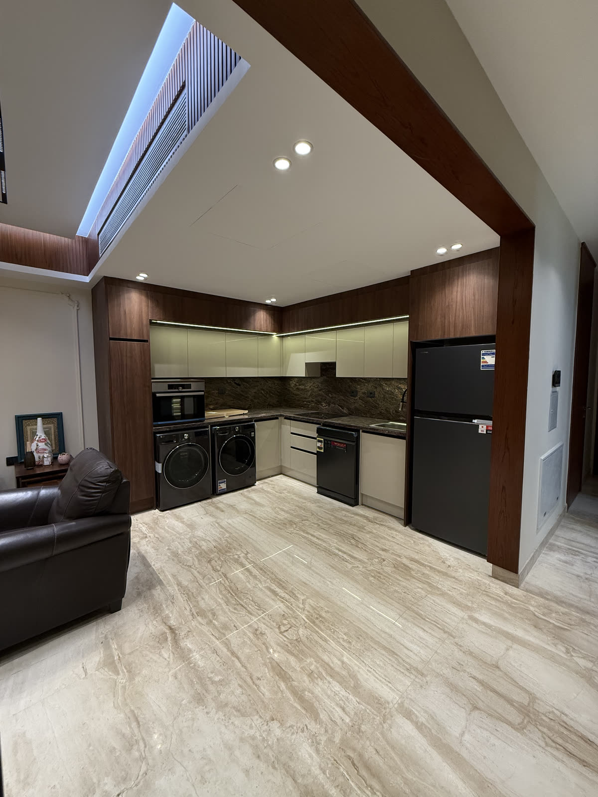 Hyde Park villa kitchen with walnut and cream cabinetry